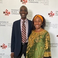 Clovis and Sherron Grant are posing for a photo together at an event.