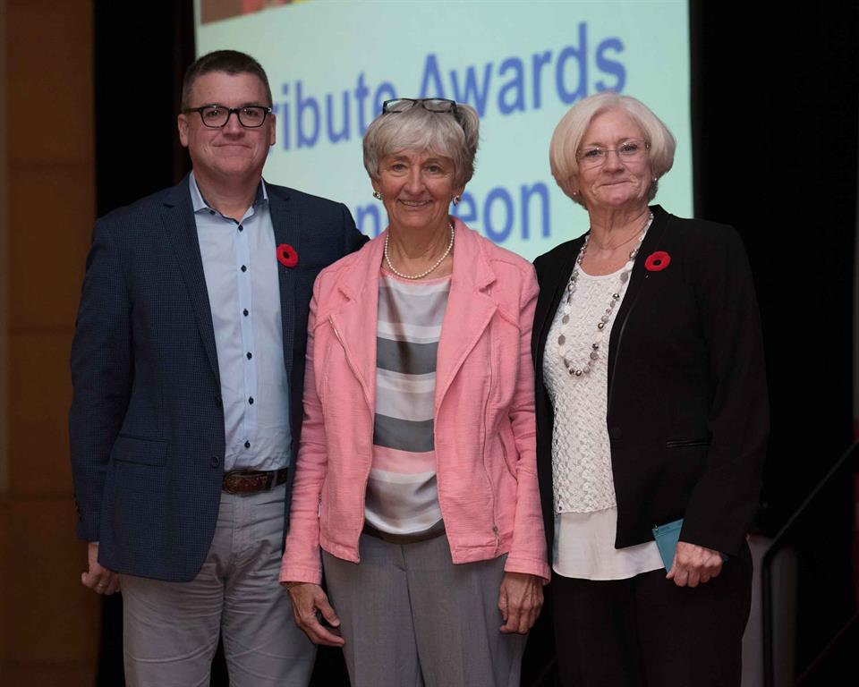 Kent Stringham, Dr. Mary Thain, Diane Pick pose for photo