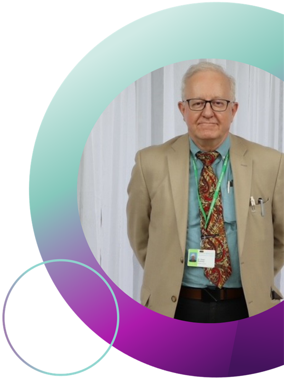 EKO Tribute Award branded purple and blue circles are featured around an image of Dr. Peter Rumney standing and smiling in front of a white curtain.