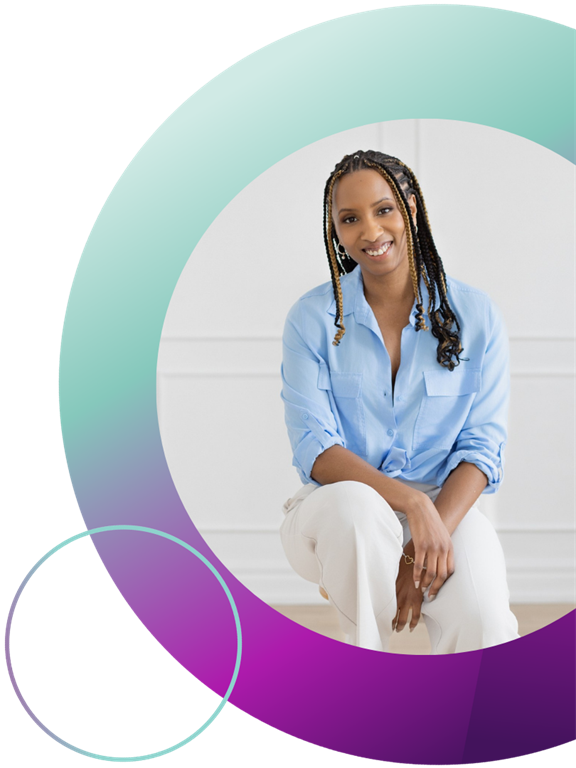 Nadia Hamilton is wearing a blue shirt and white pants, she is smiling while sitting on a stool in front of a white wall. There is a blue and purple circle surrounding the photo.